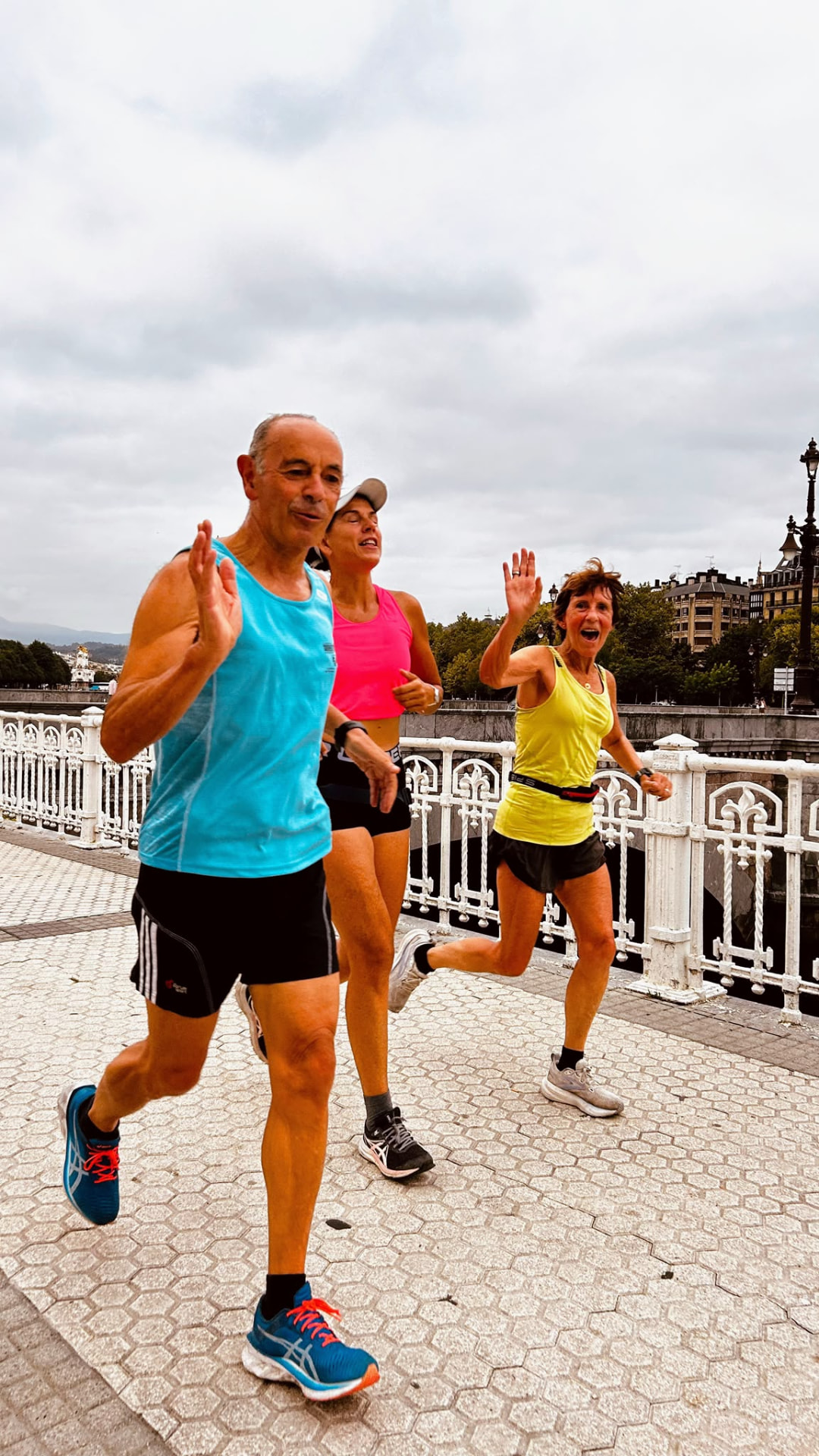 Runners high-fiving each other mid-run